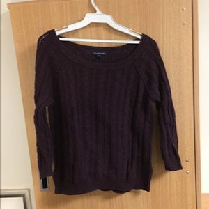 Dark purple sweater.